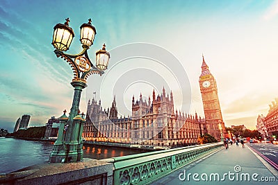 Big Ben, London the UK at sunset. Retro street lamp light on Westminster Bridge. Vintage Stock Photo