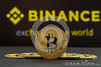 A big Bitcoin cryptocurrency coin in the centre and other bitcoin coins from both side in front of Binance crypto market . The Cartoon Illustration