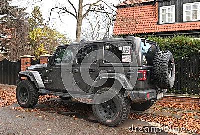 Big black high 4x4 offroad car Jeep Wrangler Sahara five door parked Editorial Stock Photo