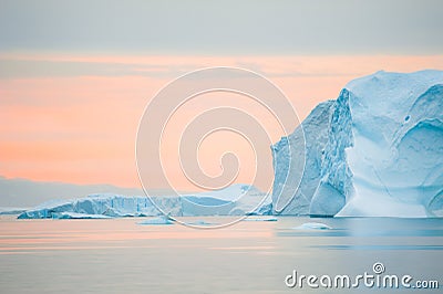 Big blue icebergs at sunset, Greenland Stock Photo