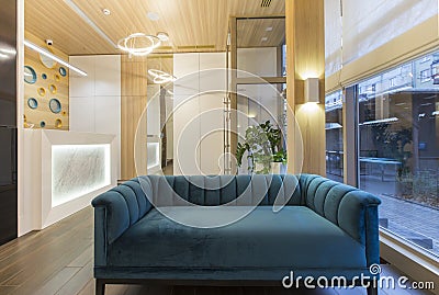 Big blue soft sofa in waiting area of children dentistry Stock Photo