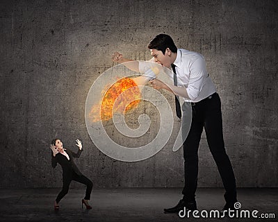 Big boss yelling to her employee with megaphone on fire Stock Photo