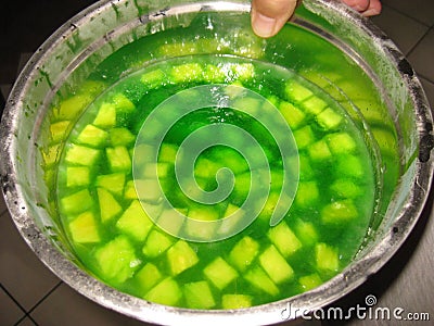 Big Bowl of Green Jello with Pineapple Chunks Stock Photo