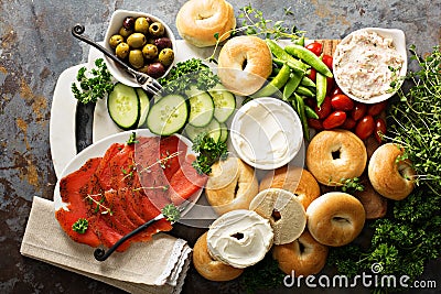 Big breakfast platter with bagels, smoked salmon and vegetables Stock Photo