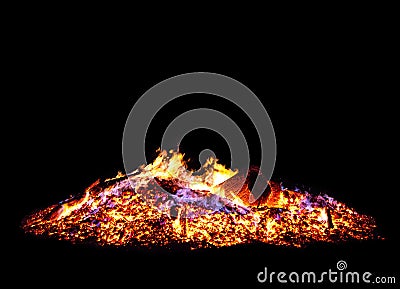 Big campfire with a lot of glowing wood and blurry flames Stock Photo