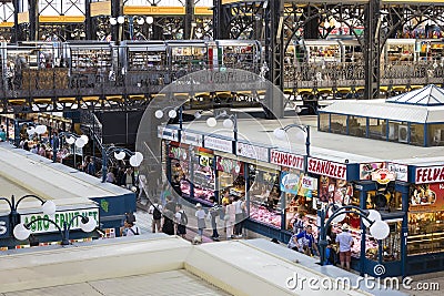 The big central market of Budapest, a place of visiting of tourists for purchases of sausages of a paprika of souvenirs. Editorial Stock Photo