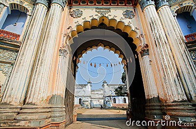 Big columnes of the entrance to historic indian palace Stock Photo