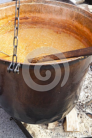 Big copper caldron on open fireplace, selective focus Stock Photo