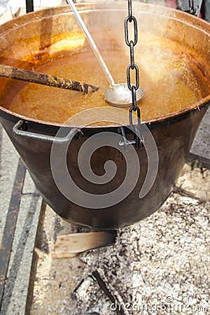 Big copper caldron on open fireplace, selective focus Stock Photo