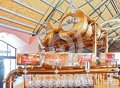 Copper Super Bock beer dispenser with glasses in Porto Editorial Stock Photo