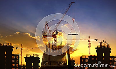 Big crane and building construction against beautiful dusky sky Stock Photo
