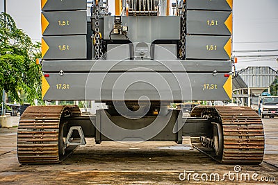 rear view of big crawler crane, counterweights and big chain Stock Photo