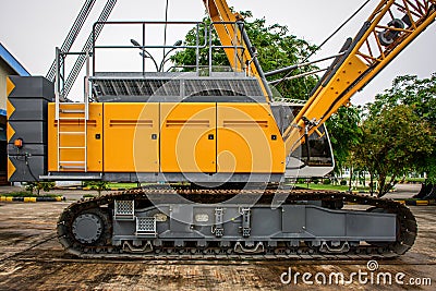 side view of crawler crane, counterweights, big chain and arms Stock Photo