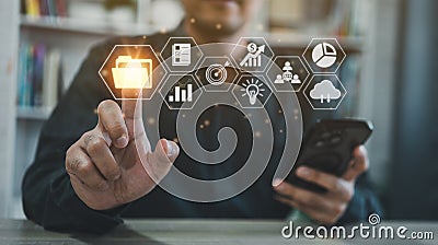 Big data clouds computing database document management system, businessman hold mobile use finger point folder and goal document Stock Photo