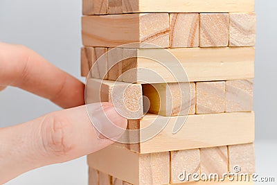 Big date moderation concept. Hand holds wooden blocks on a white background Stock Photo