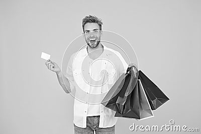 Big discount. Great choices great purchases. Happy man holding purchases in paper bags. Cheerful client customer Stock Photo