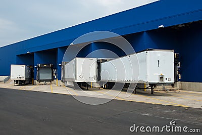 Big distribution warehouse with gates for loads and trucks Stock Photo