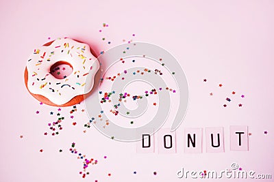 Big donut and Gingerbread donut on pink background birthday decoration Stock Photo
