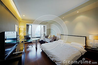 Big double bed in stylish light room Stock Photo