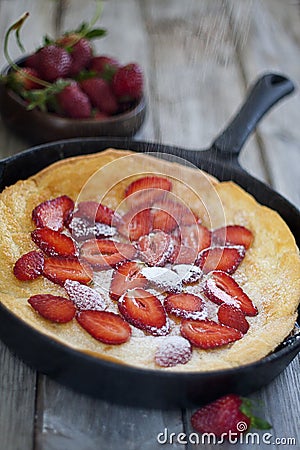 Big dutch pancake with strawberry Stock Photo