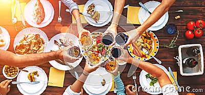 Big family dinner. Vertical top view on served table and hands w Stock Photo