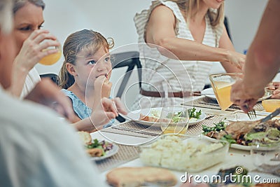 Big family, food and lunch at table in home, eating and drinking. Love, brunch and grandfather, grandmother and girl Stock Photo