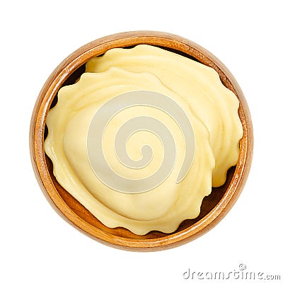 Big filled dumplings, uncooked, stuffed egg pasta in a wooden bowl Stock Photo