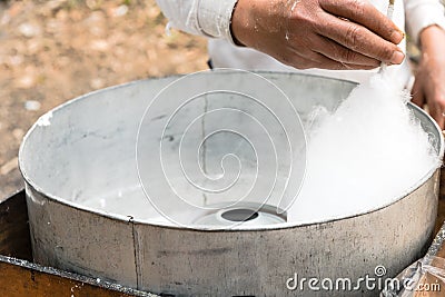 Big finished puffy white cotton candy in floss machine in Vietnam Stock Photo
