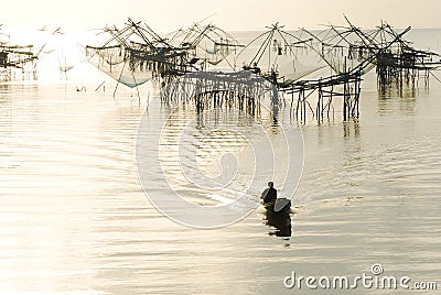 Big fishing net and the fisherman Stock Photo