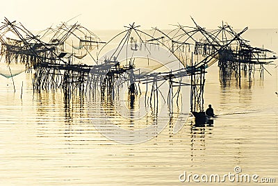 Big fishing net and the fisherman Stock Photo