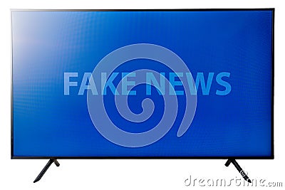 Big flat oled 4k display tv with blue background and the text fake news on the screen. Stock Photo