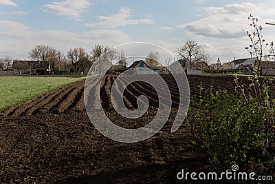 Big garden in the village. Farmland. Agricultural field on a background. Stock Photo