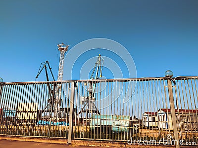 Big gate near the port of seaside. Sunny day in the city Stock Photo