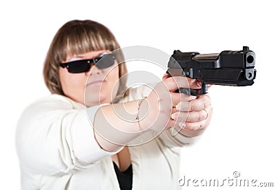 Big girl aiming a black gun Stock Photo