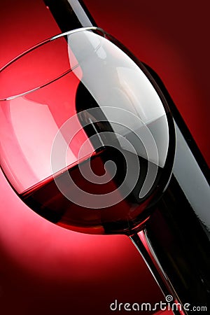 Big glass and bottle of red wine Stock Photo