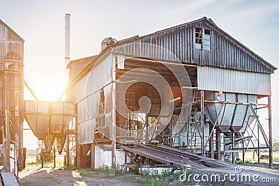 Big group of old abandoned grain dryers complex for drying wheat. Modern grain silo. Stock Photo