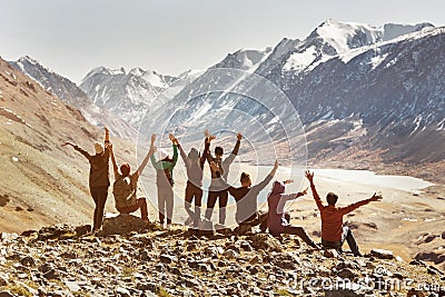 Big active company of happy friends in mountains Stock Photo