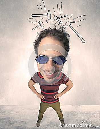 Big head person with drawn hammers Stock Photo