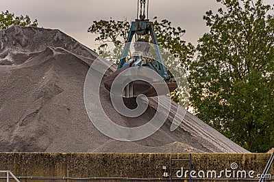 excavator collects graphite sand Stock Photo