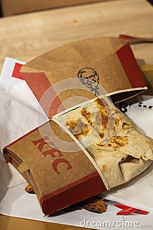 Big KFC wrap on a KFC tray in paper wrap Editorial Stock Photo