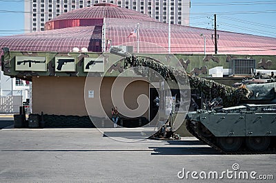 Big Leyland Motors Chieftain MK 10 tank parked in front of an American gun shop Editorial Stock Photo