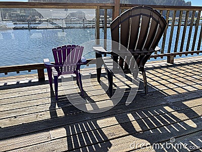 Big and little chairs set to view Salmon Harbor Stock Photo