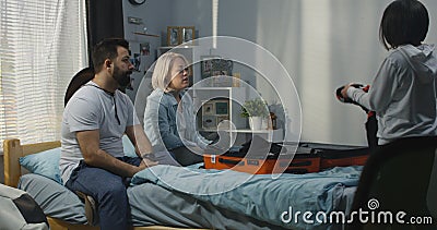 Family helping mother packing Stock Photo