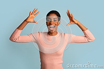 Big Luck. Excited Euphotic Black Woman Shouting With Joy And Raising Hands Stock Photo