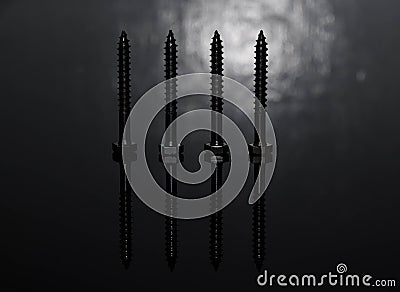 big metal screw with reflection on black background Stock Photo