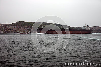 A big oil tanker passing under the bridge in the Bosphorus Stock Photo