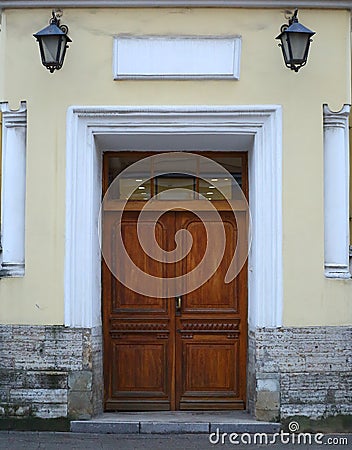 Big old closed light wooden door Stock Photo