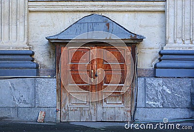 Big old closed light wooden door Stock Photo