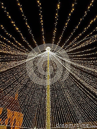 Big open umbrella made out of lights in the middle of town as Christmas decoration Stock Photo