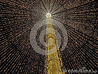 Big open umbrella made out of lights in the middle of town as Christmas decoration Stock Photo